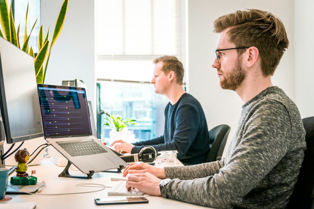 The StratEdge consulting team working together in their Portland office